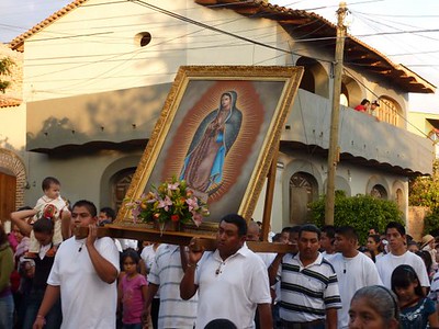 Believers carrying an image of the Virgin of Guadalupe