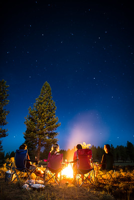 Friends around bonfire