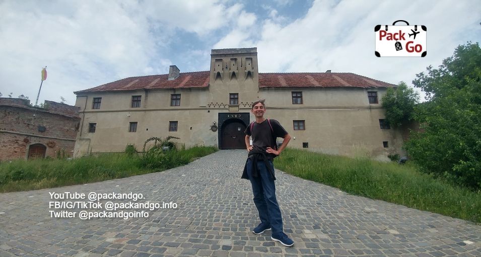 Man at the entrance of Brasov Fortress, Romania.