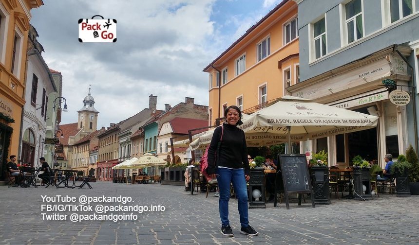 Tourist woman around Council Square Brasov, Romania