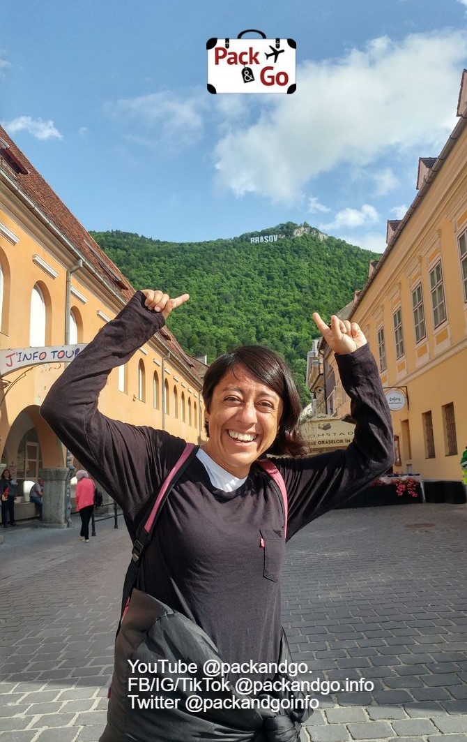 Woman pointing the Tampa Mountain, Brasov, Romania
