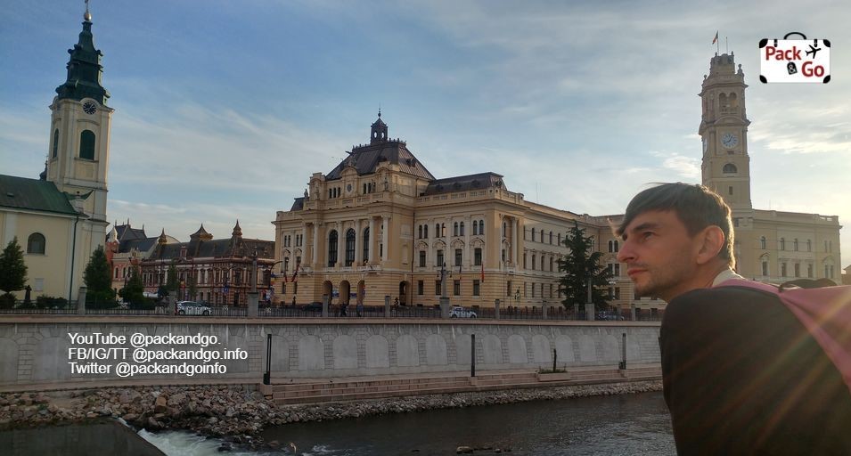 Man observing the river and buildings in Oradea, Romania