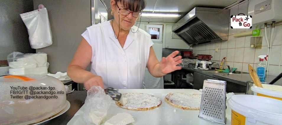 Romanian woman preparing palacinta, Oradea, Romania
